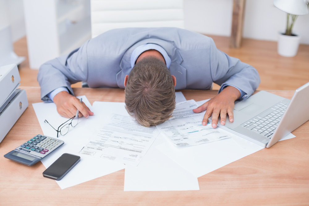 Image of a businessman stressed due to out of control legal fees.