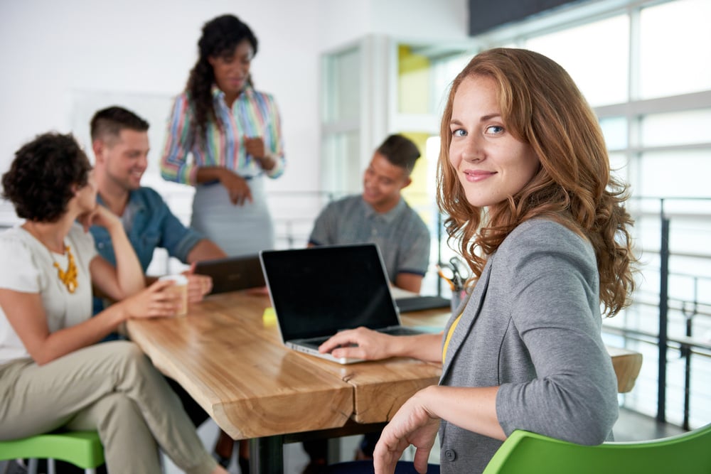 Image of a small business lawyer meeting with clients.