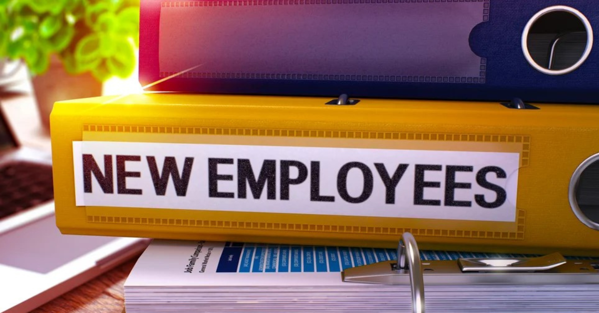 Binder labeled 'New Employees,' symbolizing considerations businesses face when classifying workers as employees or independent contractors.